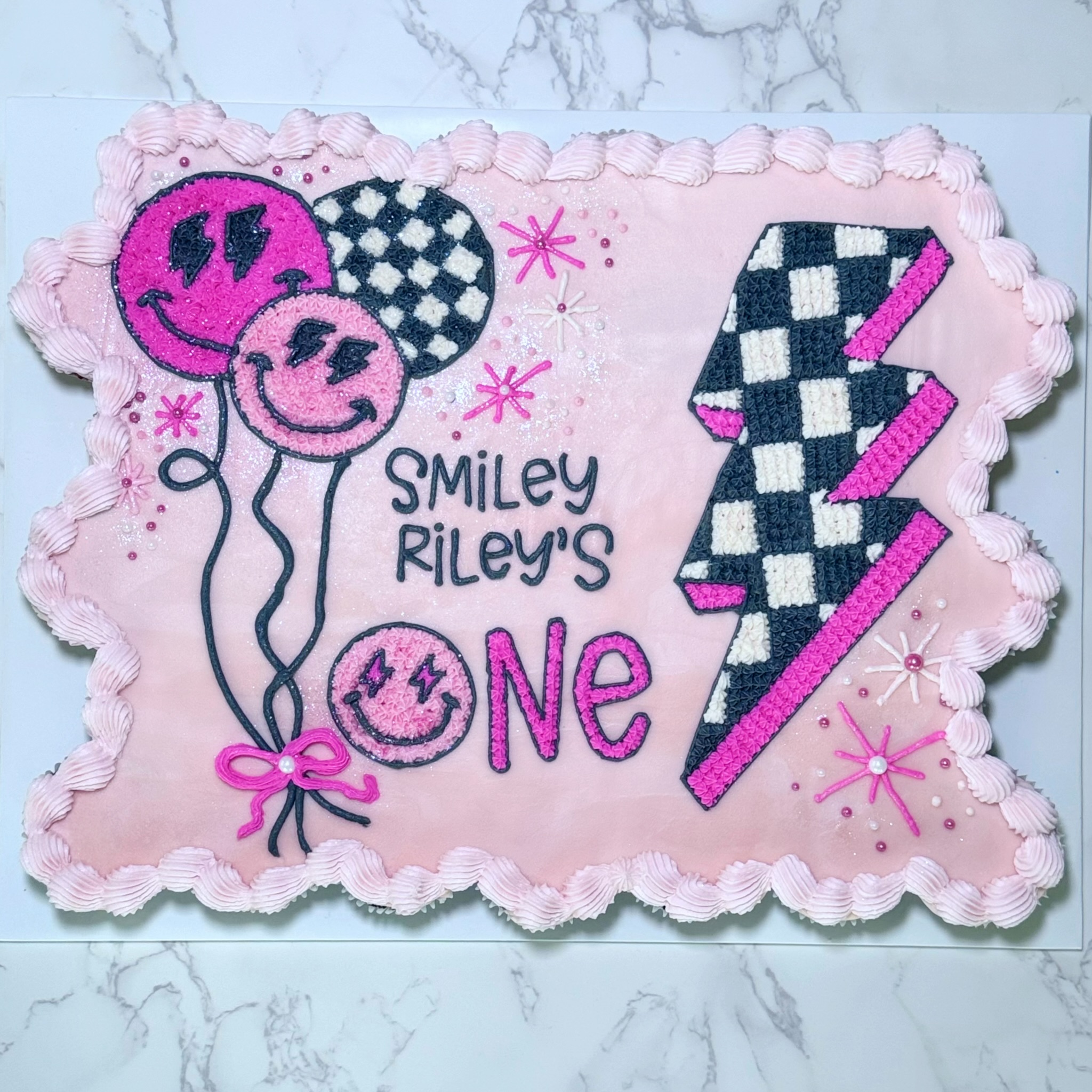 Smiley checkered birthday cake